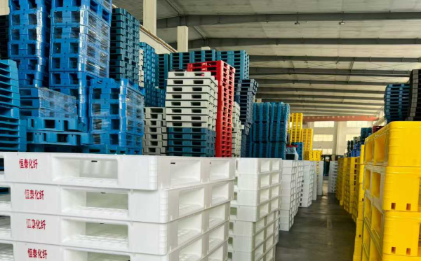 Plastic pallet with steel reinforcement